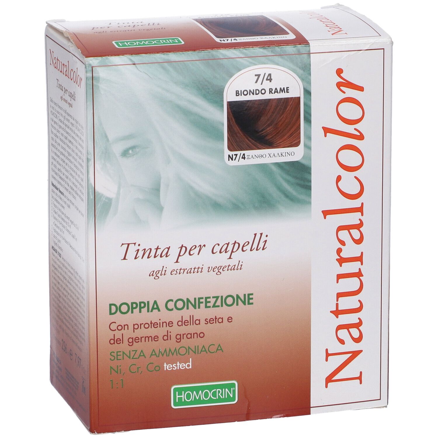 Scatola tinta per capelli Naturalcolor. Tonalità 7/4 Biondo Rame. Testo: Tinta per capelli. Logo Homocrin.
