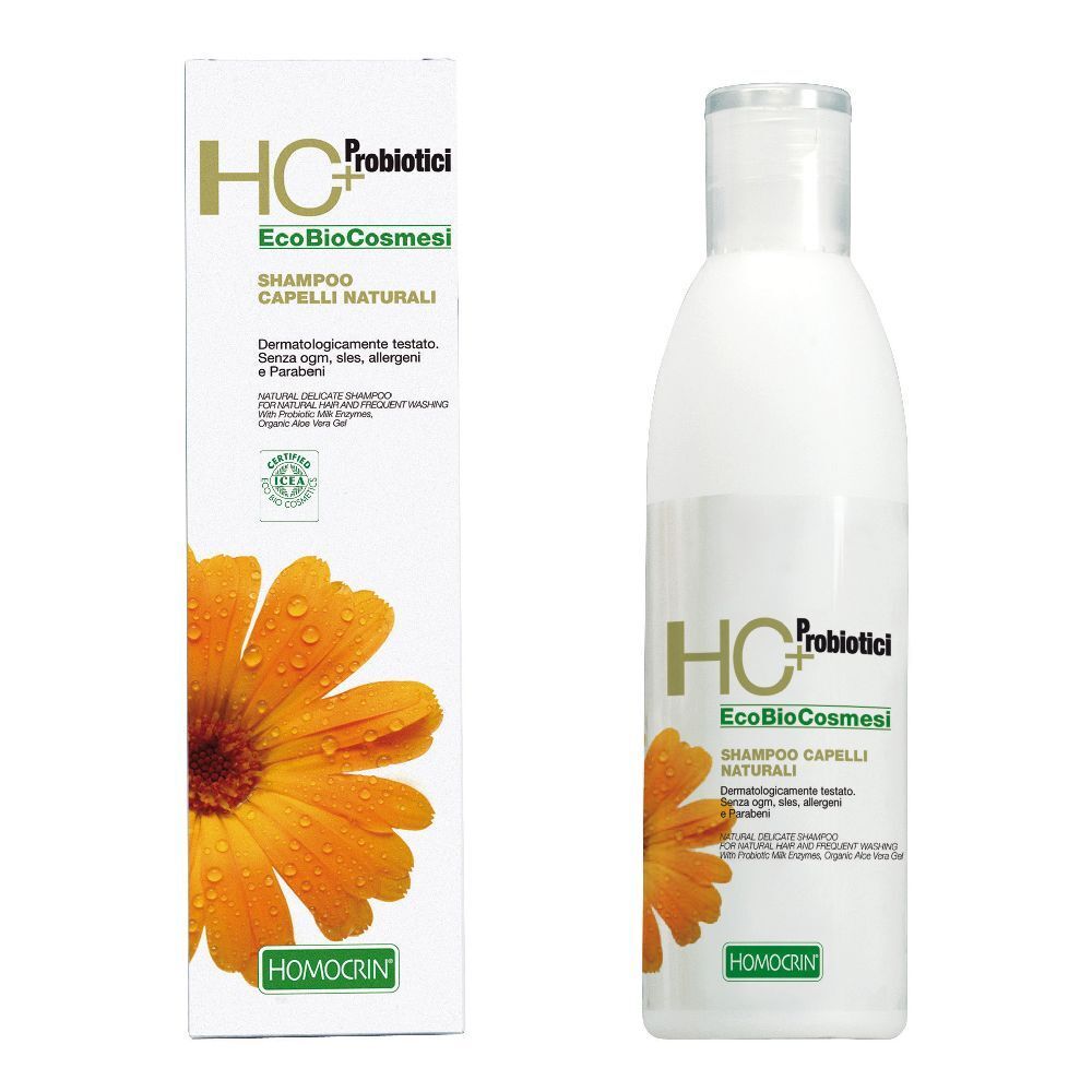 Bottiglia e scatola di shampoo. Sulla confezione "HC+ Probiotici EcoBioCosmesi Shampoo Capelli Naturali". Logo floreale e testo "HOMOCRIN".