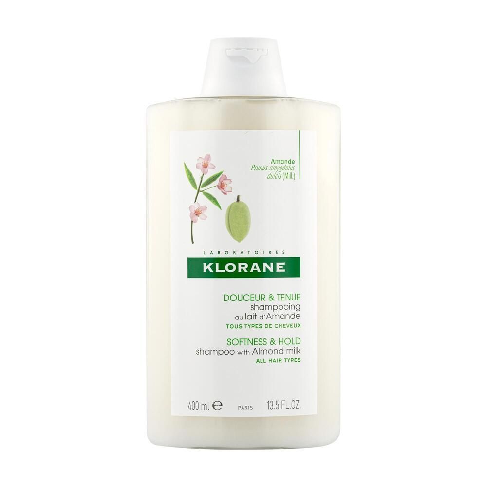 Shampoo-Flasche mit weißem Etikett. Aufschrift: KLORANE, Douceur & Tenue, Shampooing au lait d'Amande, Softness & Hold, Mandelmilch-Shampoo.