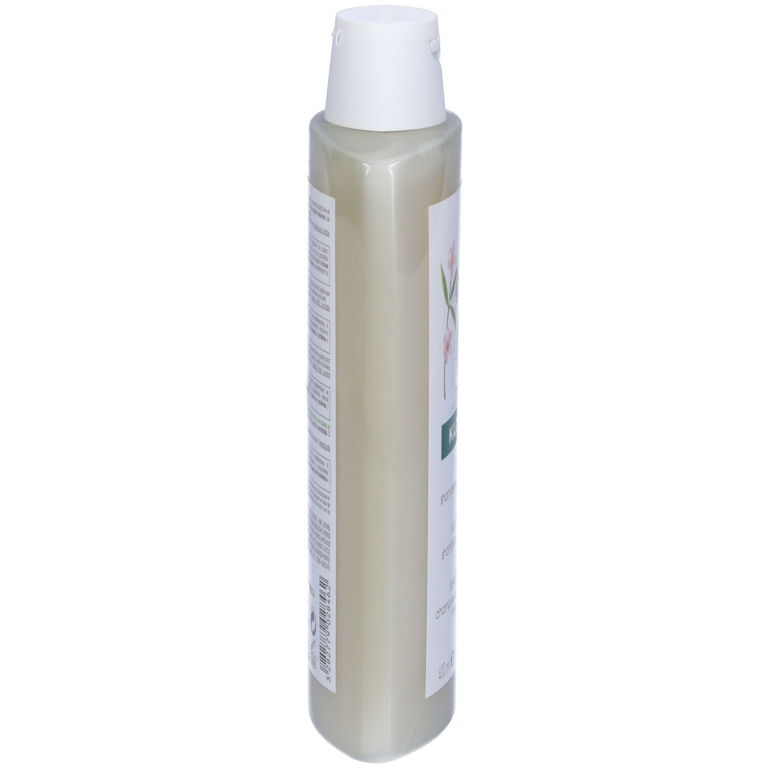 Seitenansicht der Shampoo-Flasche. Aufschrift: KLORANE, Douceur & Tenue, Shampooing au lait d'Amande, Morbidezza & Tenuta, Suavidad y Tonicidad.