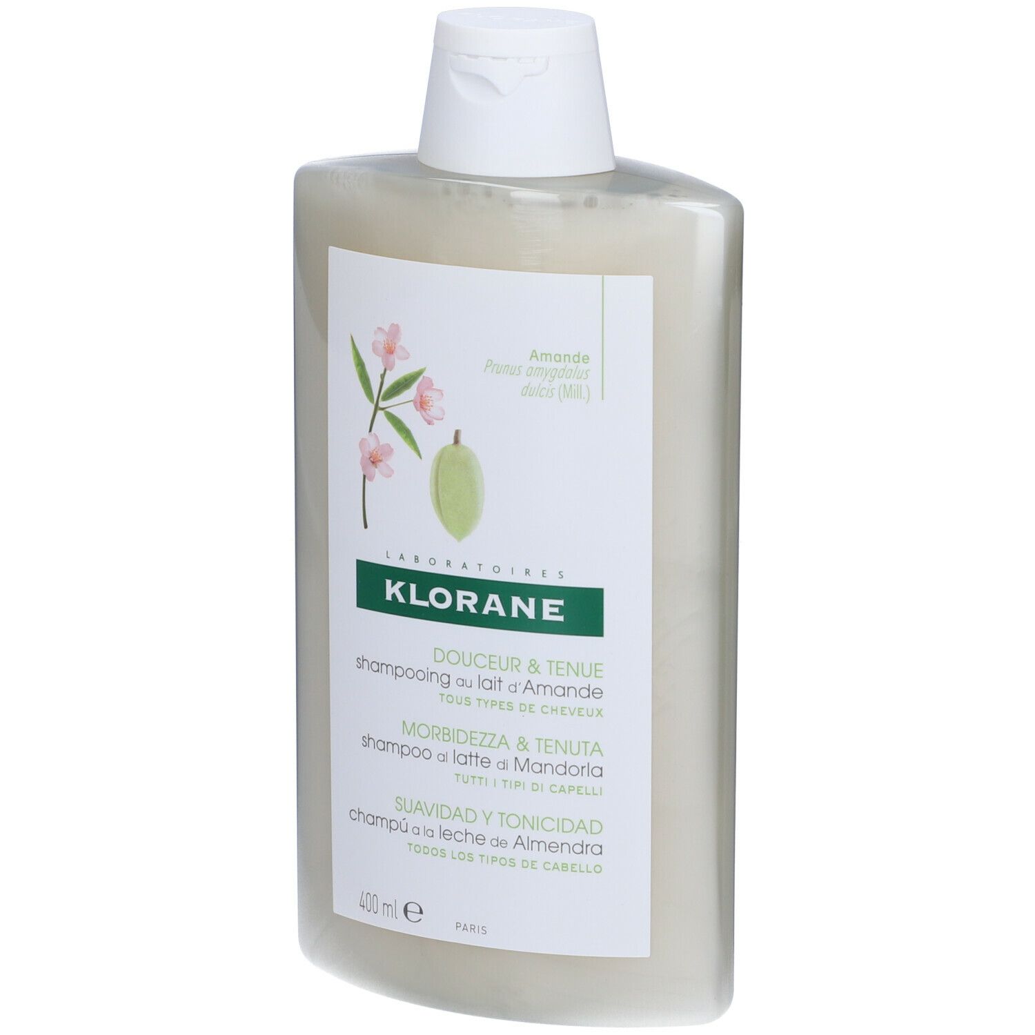 Shampoo-Flasche mit weißem Etikett. Aufschrift: KLORANE, Douceur & Tenue, Shampooing au lait d'Amande, Morbidezza & Tenuta, Suavidad y Tonicidad.