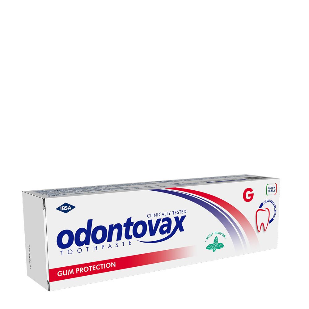Scatola di dentifricio Odontovax, protezione gengive, clinicamente testato. Aroma menta. Grafica rossa e blu.
