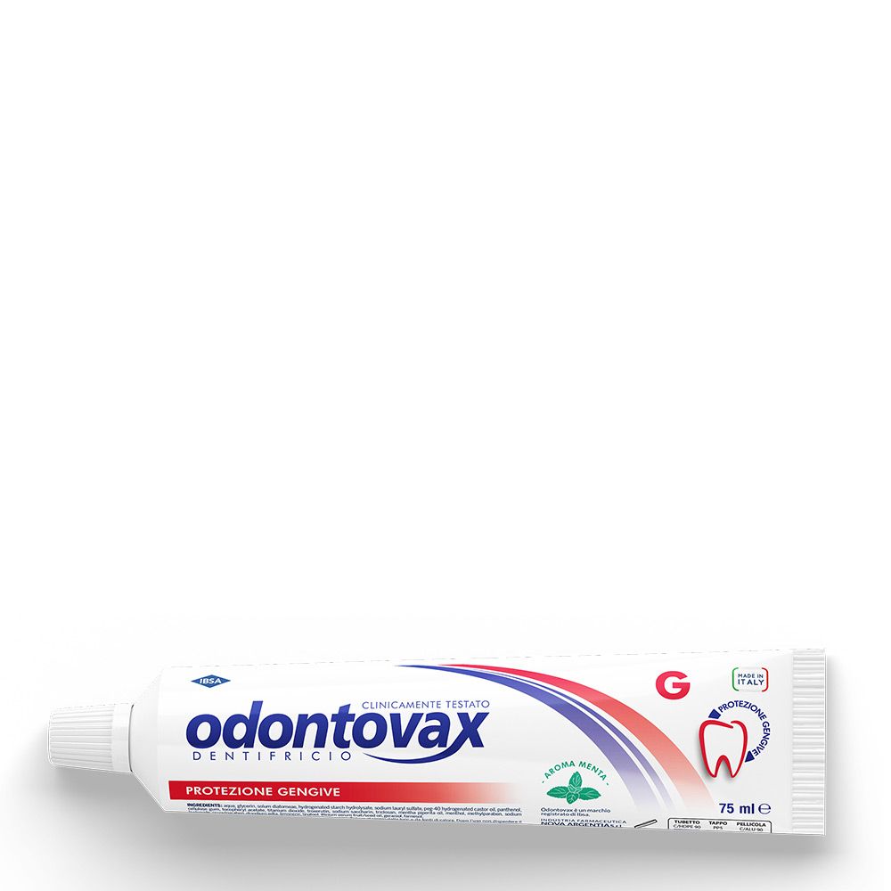 Tubo di dentifricio bianco con design blu e rosso. Scritta: Odontovax, clinicamente testato. Aroma menta. Protezione gengive.