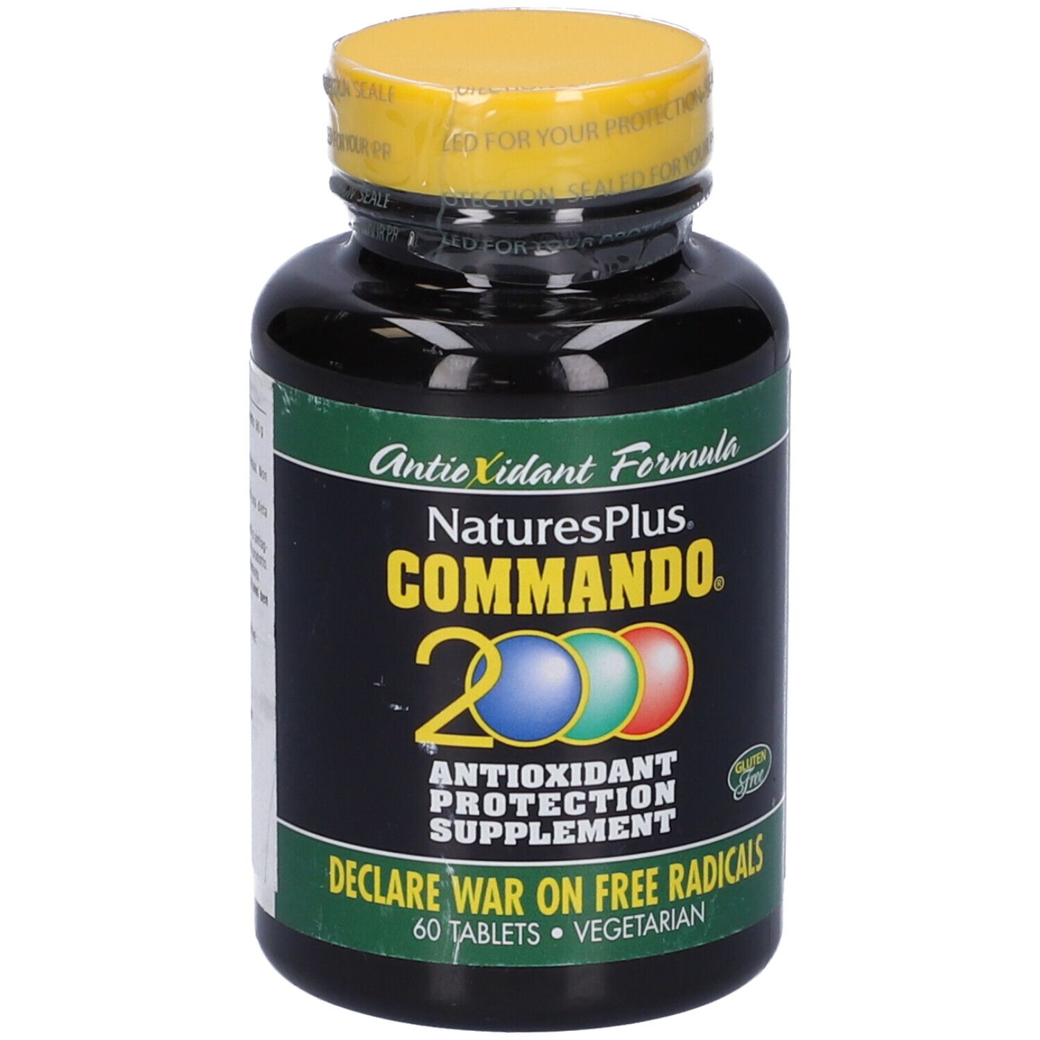 Flacone nero con tappo giallo. Scritta: Commando 2000, integratore di protezione antiossidante. 60 compresse. Senza glutine.