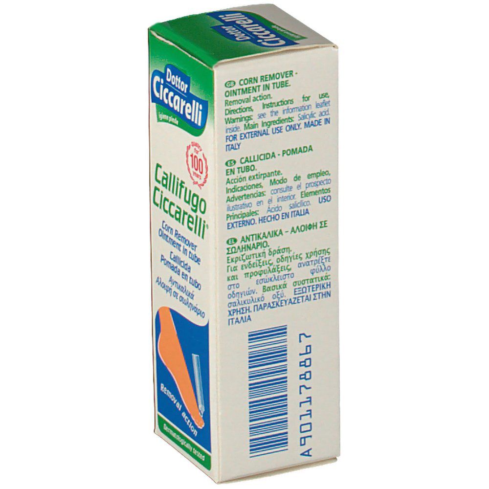 Vista laterale della scatola. Testo: Corn Remover Ointment in tube. Ingredienti. Codice a barre e informazioni produttore. Confezione verde e bianca.