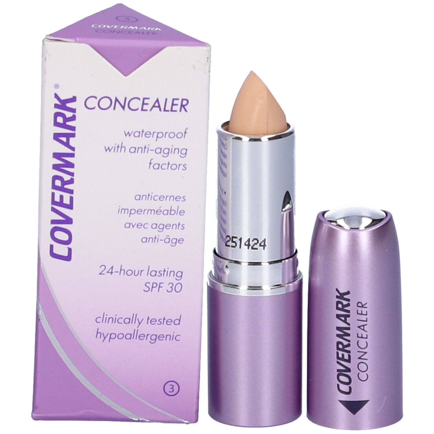 Stick correttore beige con corpo argento e astuccio viola. Accanto, la confezione con testo.