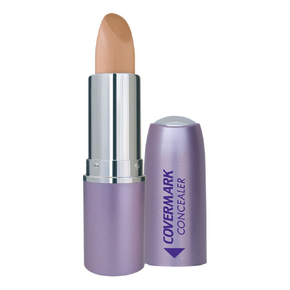 Stick correttore aperto. Tonalità 6. Visibile lo stick beige. Lo stick ha un fusto argento e viola.