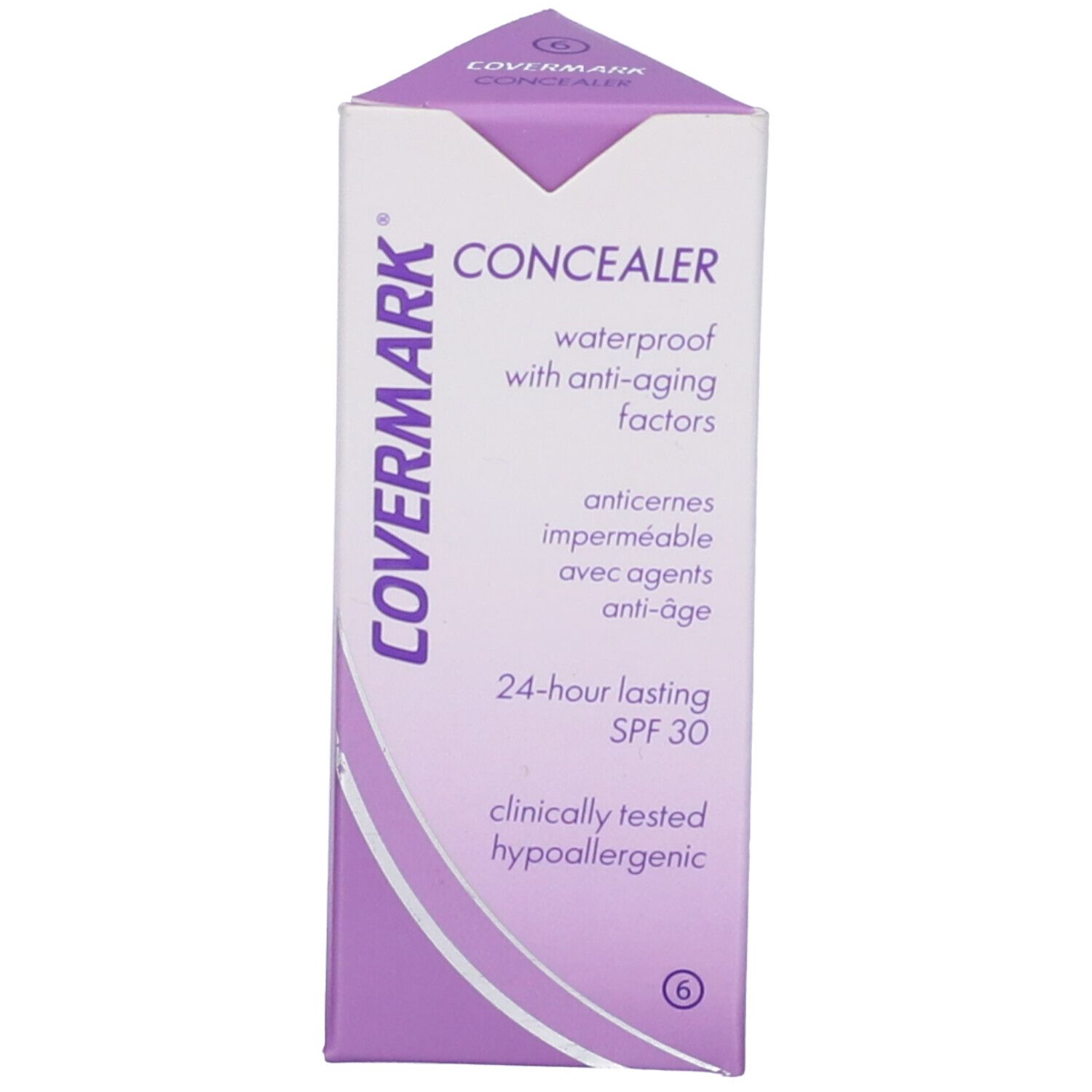 Confezione con stick correttore. Sulla confezione è scritto 'COVERMARK CONCEALER'. Lo stick è chiuso.