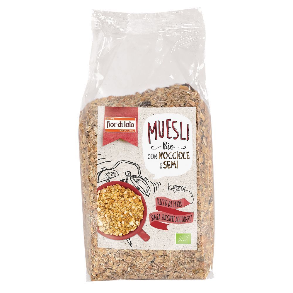 Sacchetto trasparente di muesli. Etichetta con 'Muesli Bio con Nocciole e Semi'. Contiene nocciole e semi.