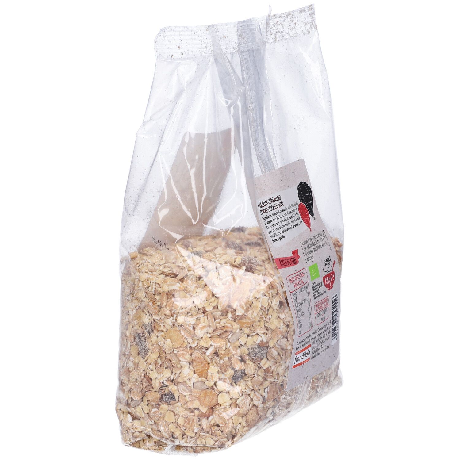 Sacchetto trasparente di muesli. Etichetta 'Muesli Bio con Nocciole e Semi'. Contiene nocciole e semi.