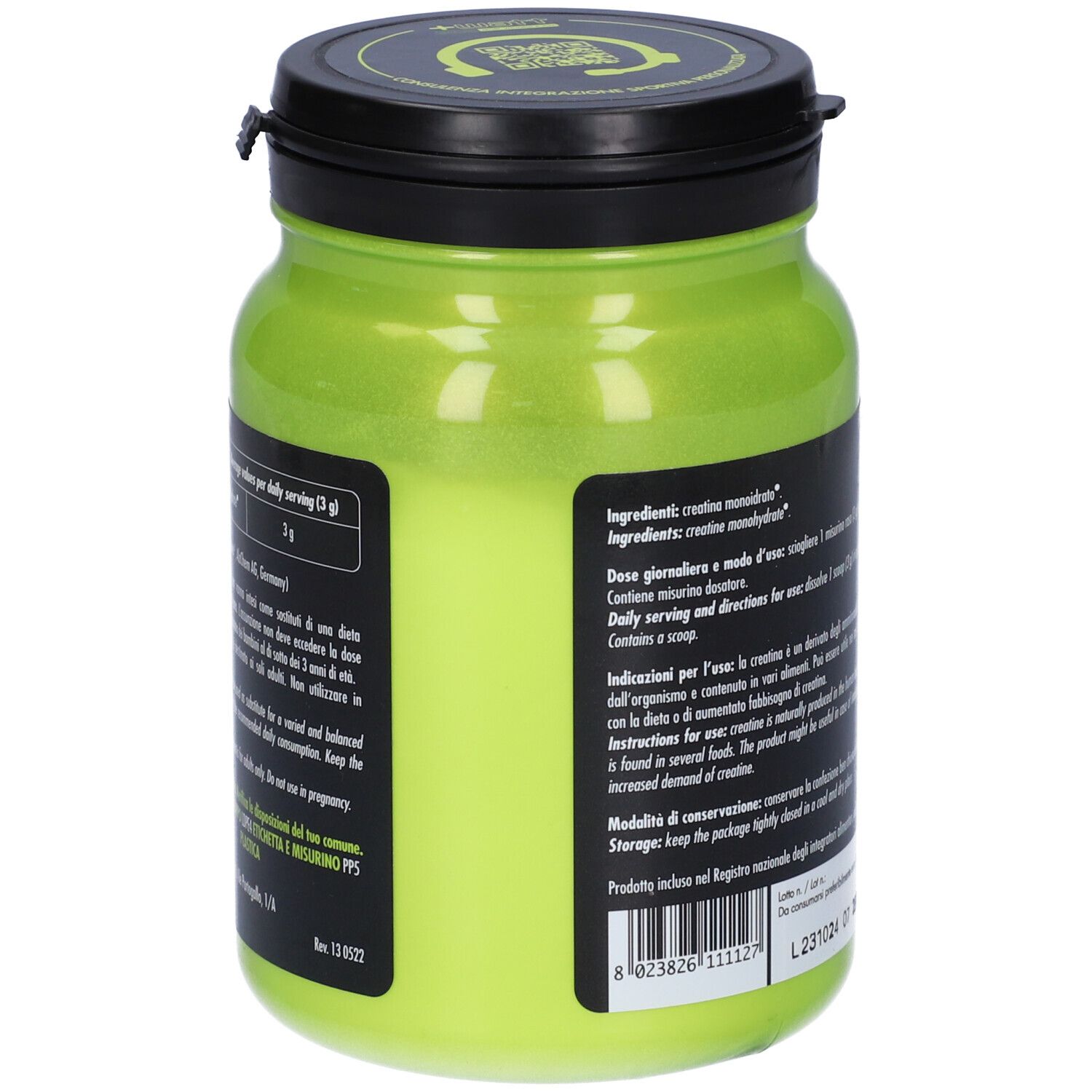 Contenitore verde di integratore con coperchio nero. Testo con ingredienti e dosaggio. Contiene creatina monoidrato.