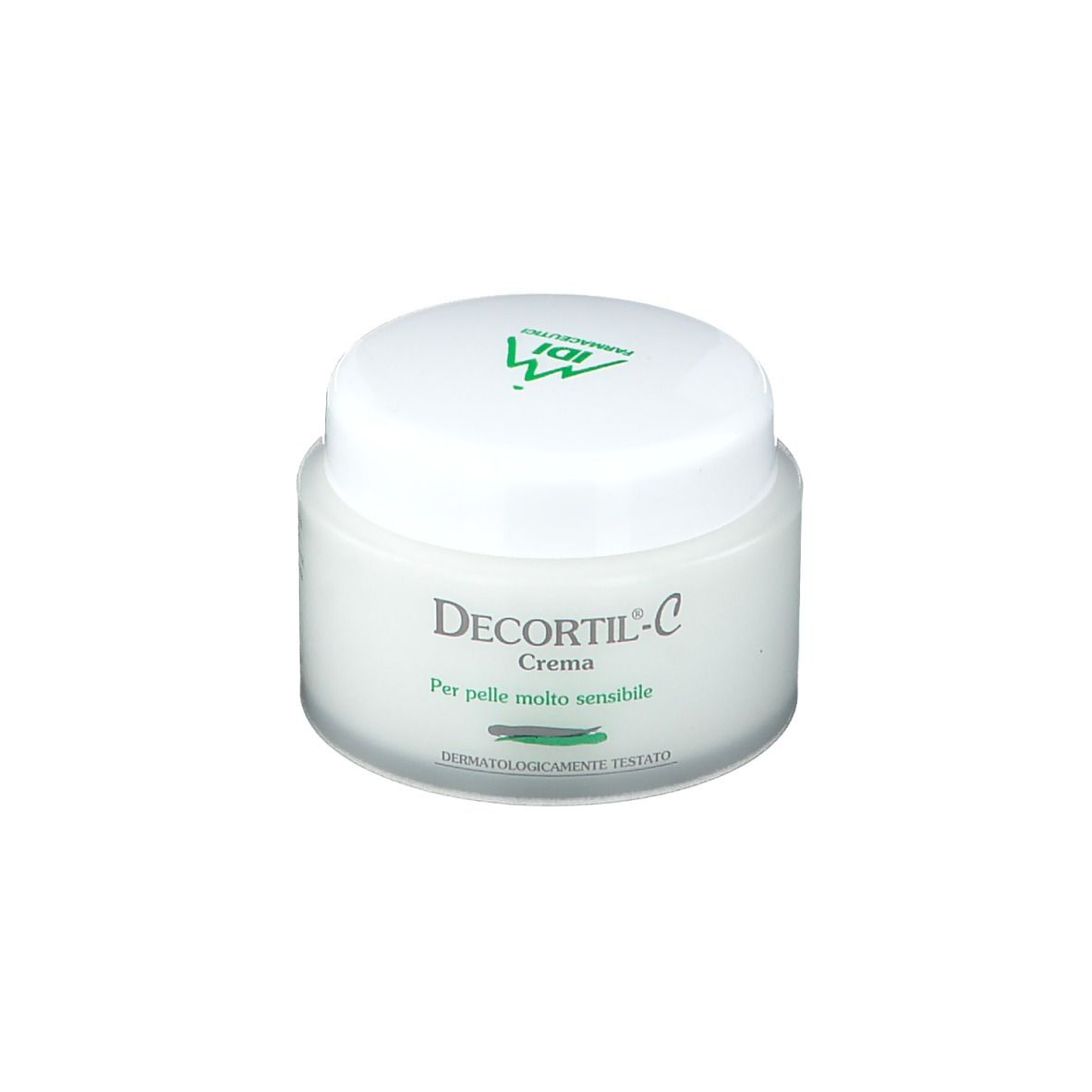 Vasetto di crema bianco con coperchio verde. Scritta: Decortil-C Crema. Per pelli molto sensibili. Dermatologicamente testato.