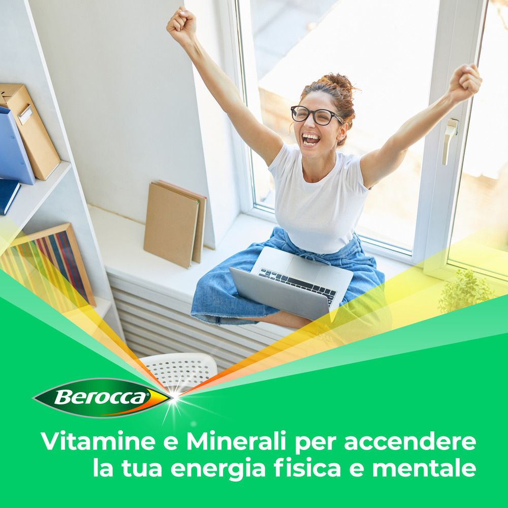 Frau sitzt am Fenster mit Laptop. Berocca-Logo und Text: Vitamine und Mineralien.