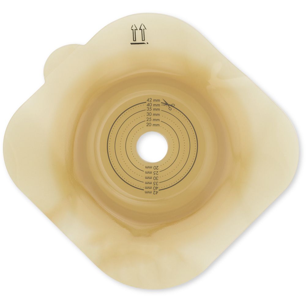 Placca base convessa beige. Cerchi concentrici con indicazioni di misura. Frecce e simbolo forbici.
