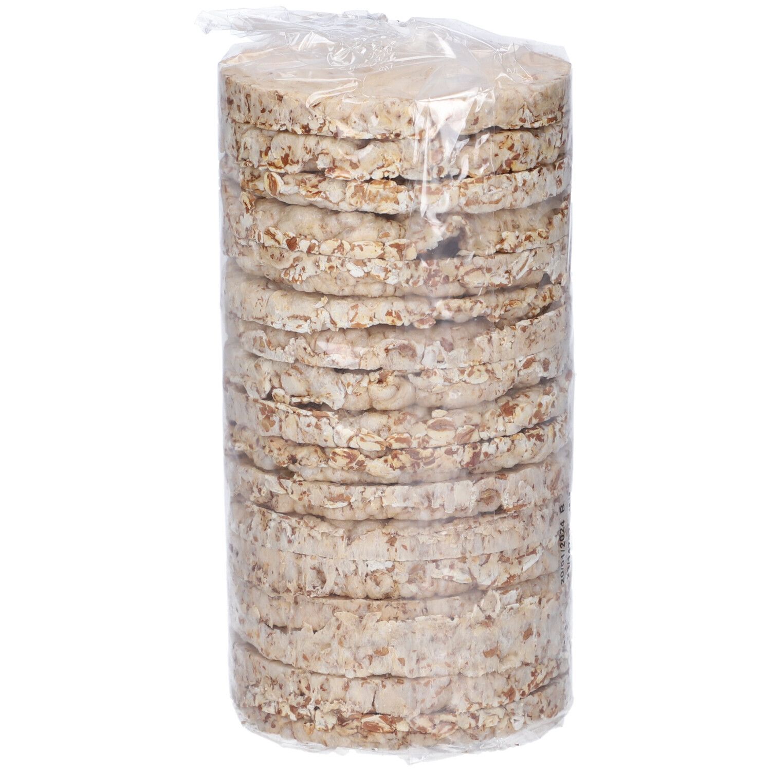 Confezione trasparente con gallette di farro pressate rotonde. Pila di gallette, visibile attraverso l'imballaggio.