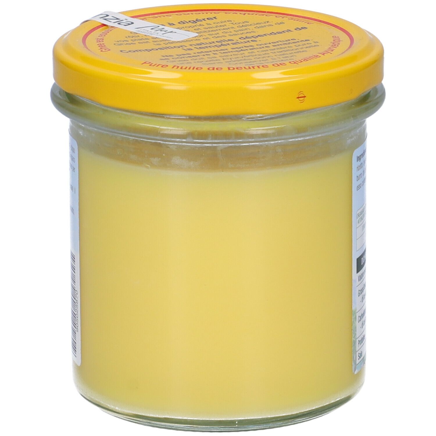 Vasetto di ghee. Grasso giallo, coperchio giallo. Etichetta con testo. Primo piano.