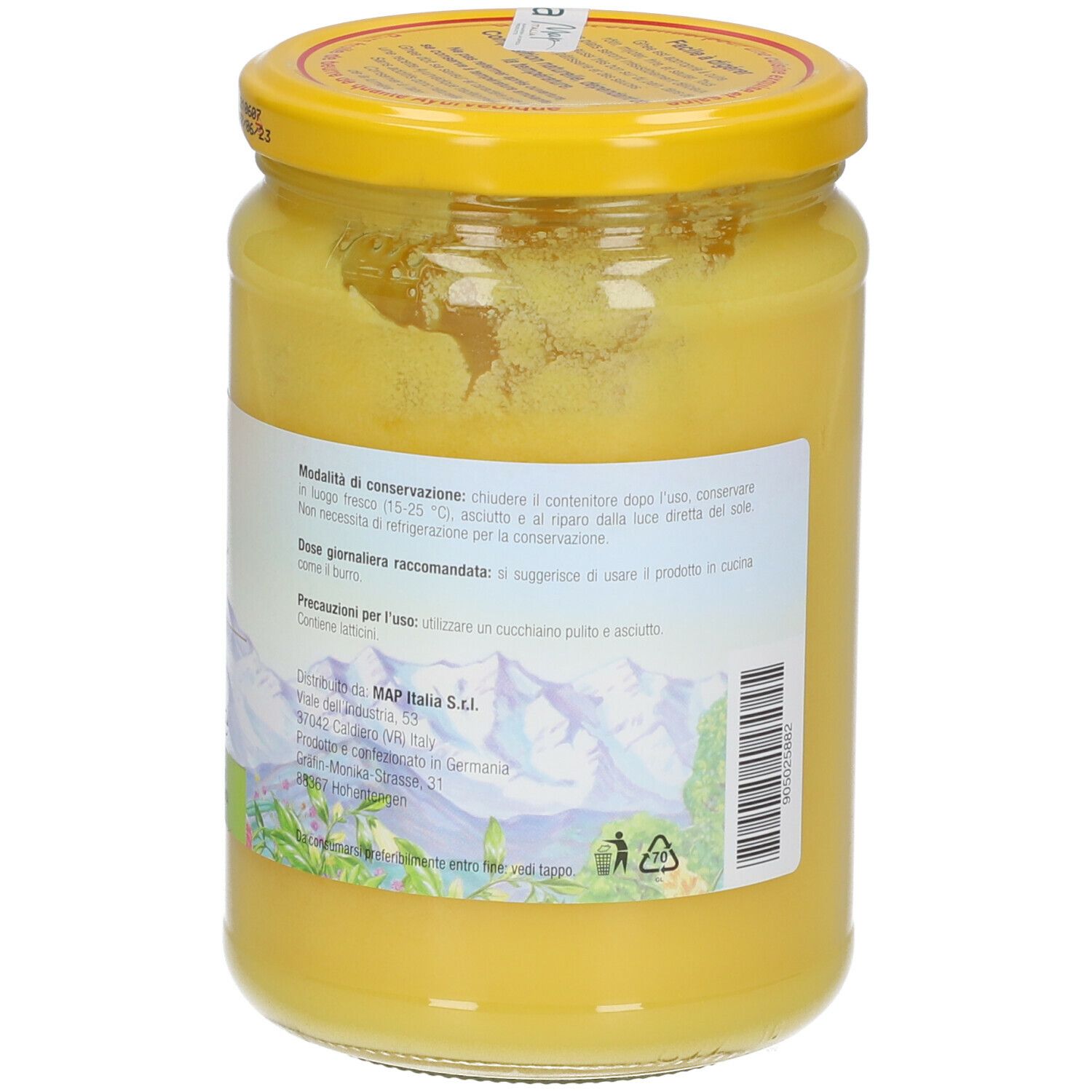 Retro del vasetto di ghee. Etichetta con informazioni. Grasso giallo visibile. Coperchio giallo.