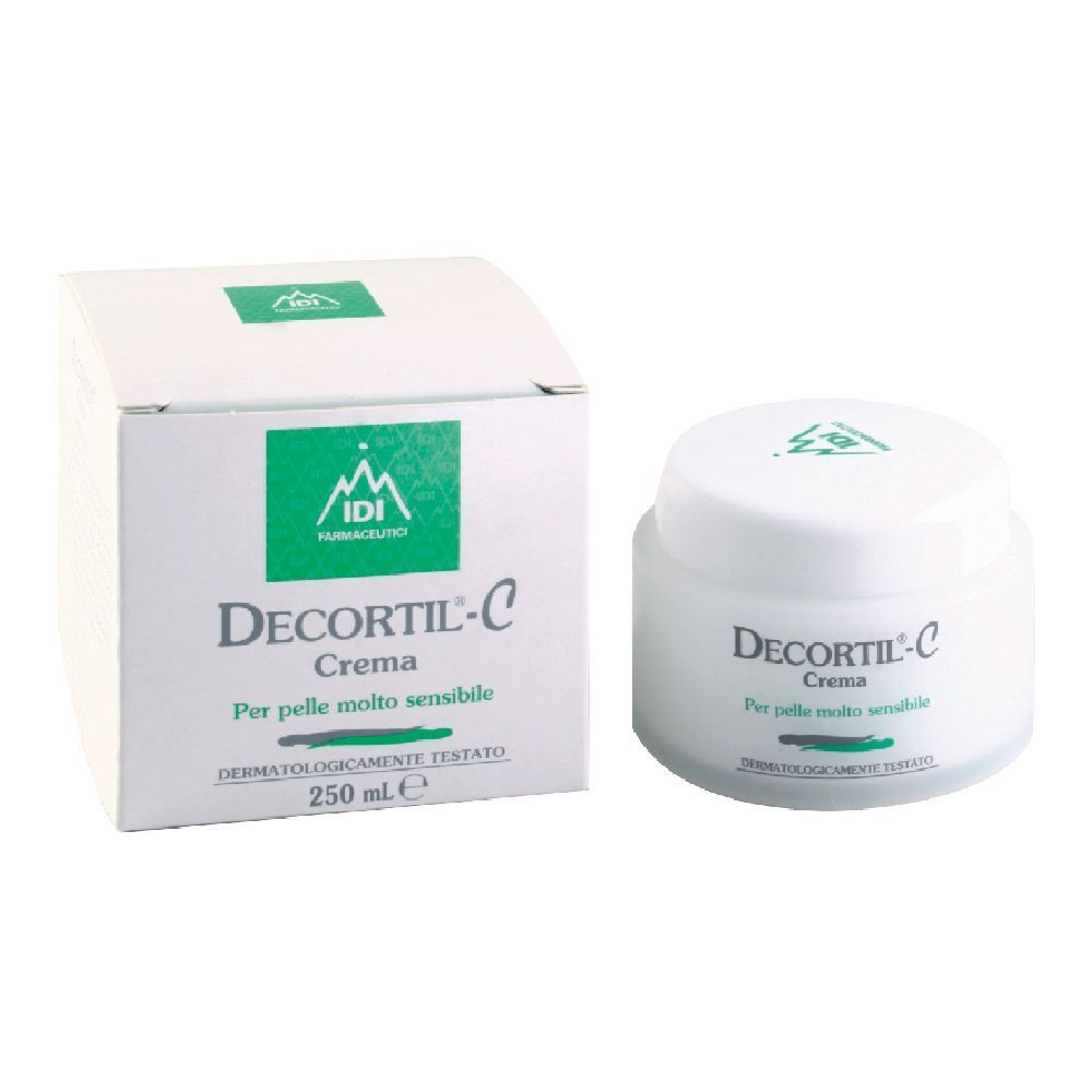 Vaso e confezione di crema. Bianchi, con logo e testo verdi. Scritta: Decortil-C Crema, per pelli molto sensibili. 250 ml.