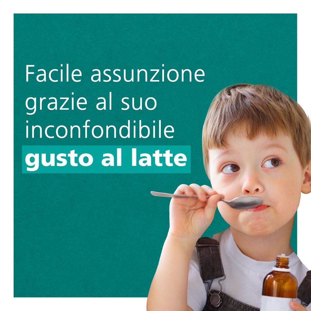Bambino con cucchiaio. Gusto latte. Integratore alimentare.
