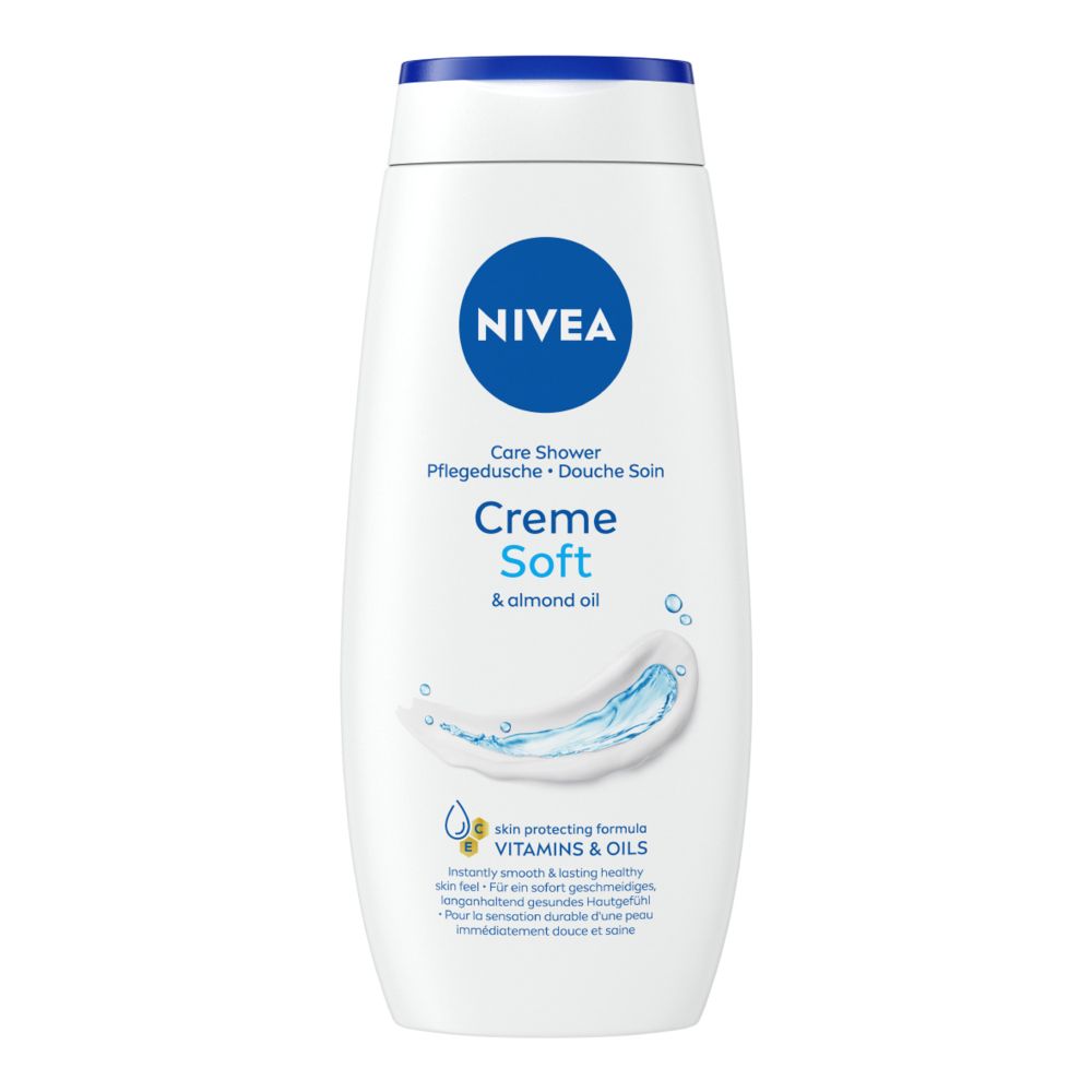 Flacone bianco con tappo blu e logo. Testo: Creme Soft & almond oil. Pflege Dusche. Con vitamine e oli.