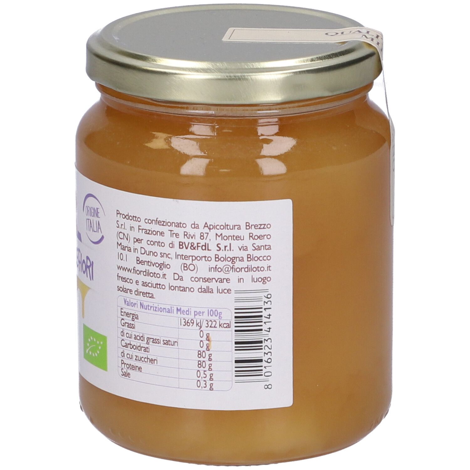 Vasetto di miele. Etichetta con scritta Miele Millefiori, marchio bio. Origine Italia. Valori nutrizionali.