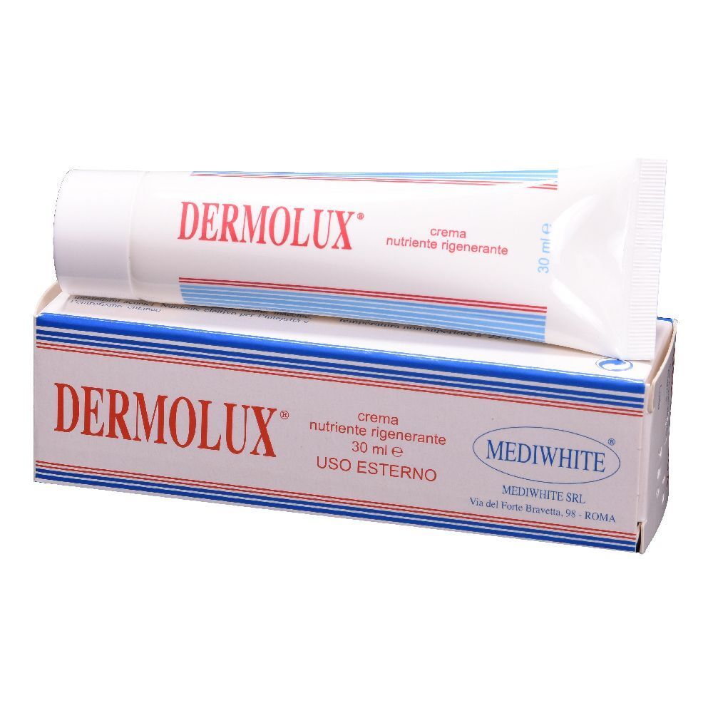 Tubo e scatola bianchi con scritte rosse e blu. "DERMOLUX" è scritto sul tubo e sulla scatola.