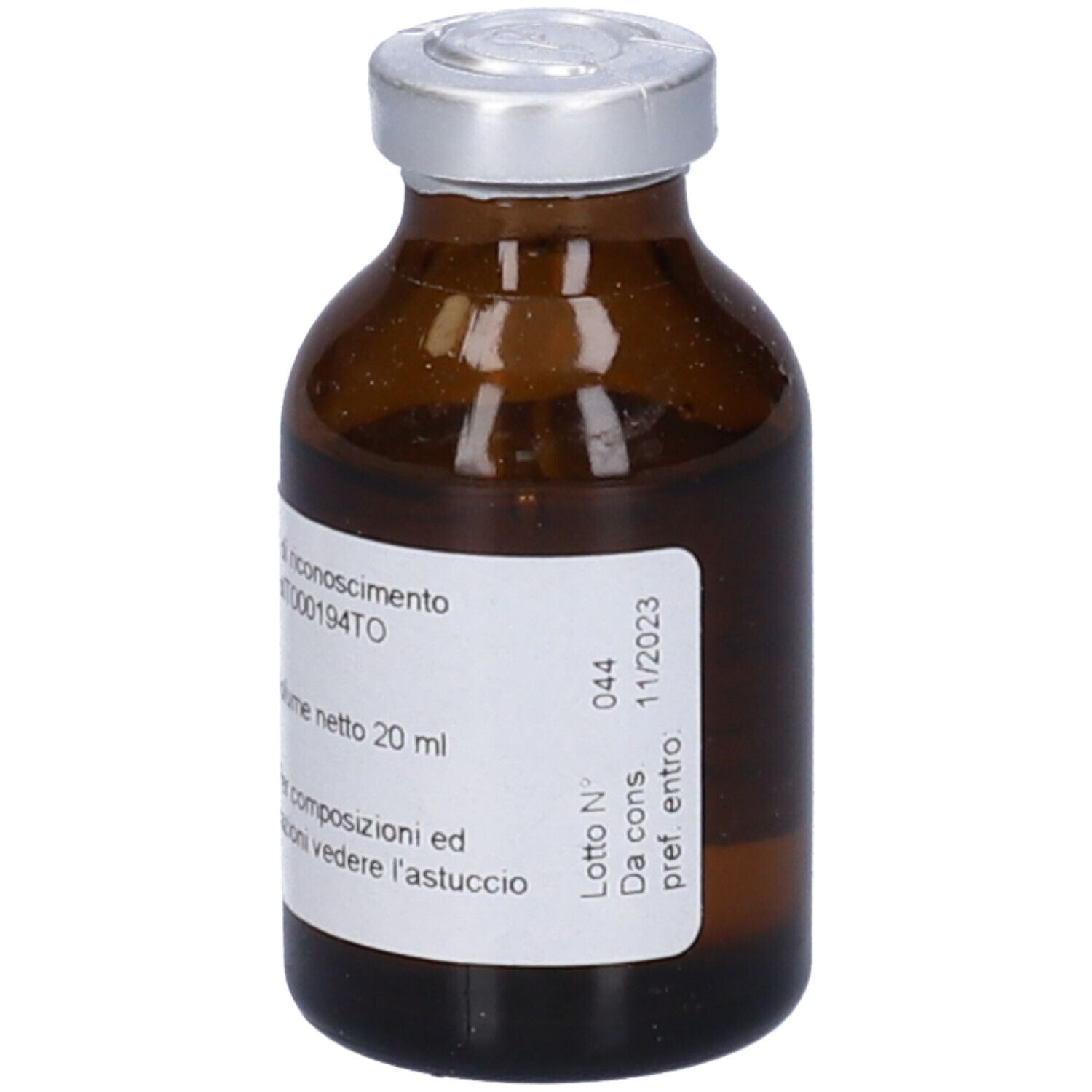 Piccola bottiglia di vetro marrone con tappo argentato. Etichetta con testo: Volume netto 20 ml, e data di scadenza: 11/2023.