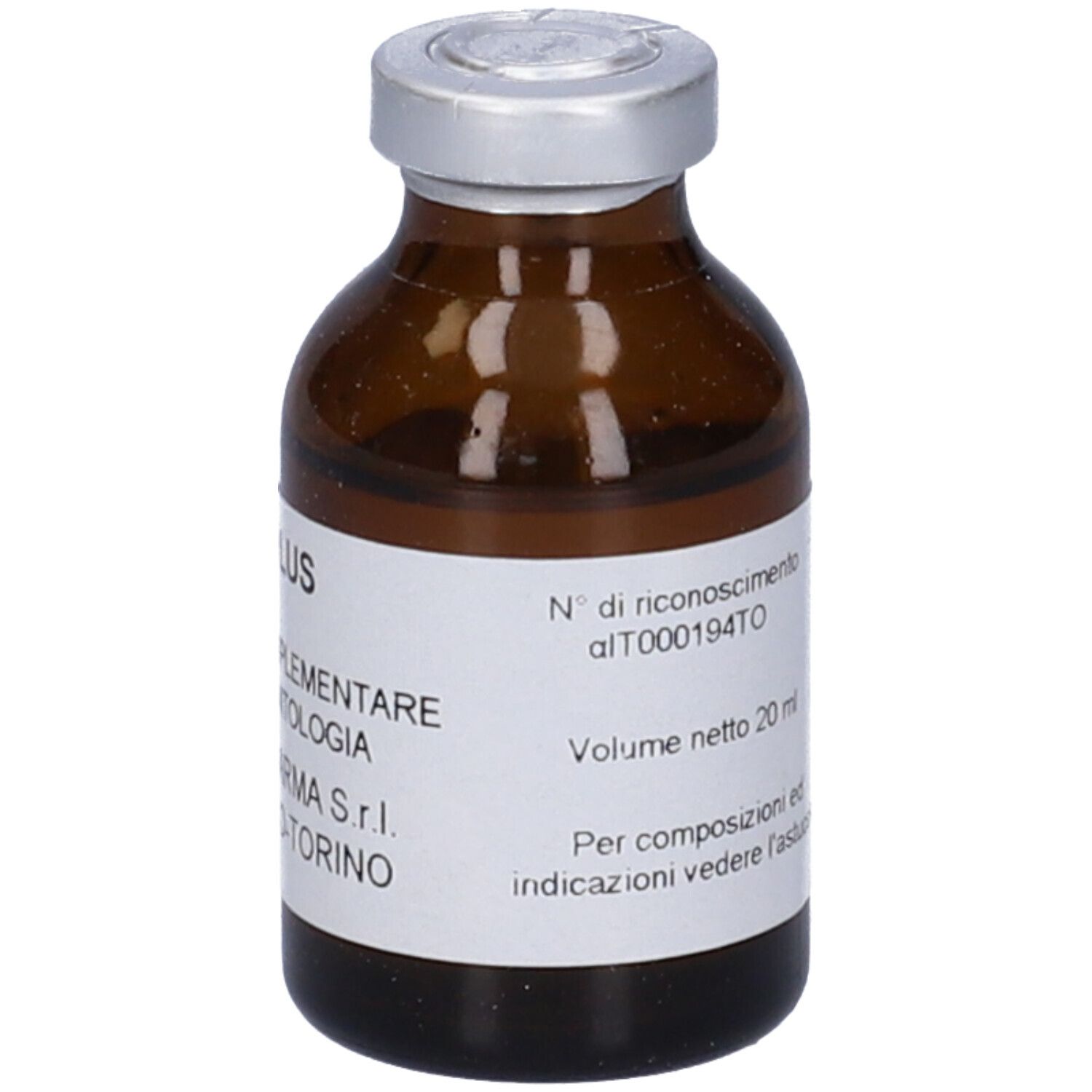 Piccola bottiglia di vetro marrone con tappo argentato. Etichetta con testo: Volume netto 20 ml.