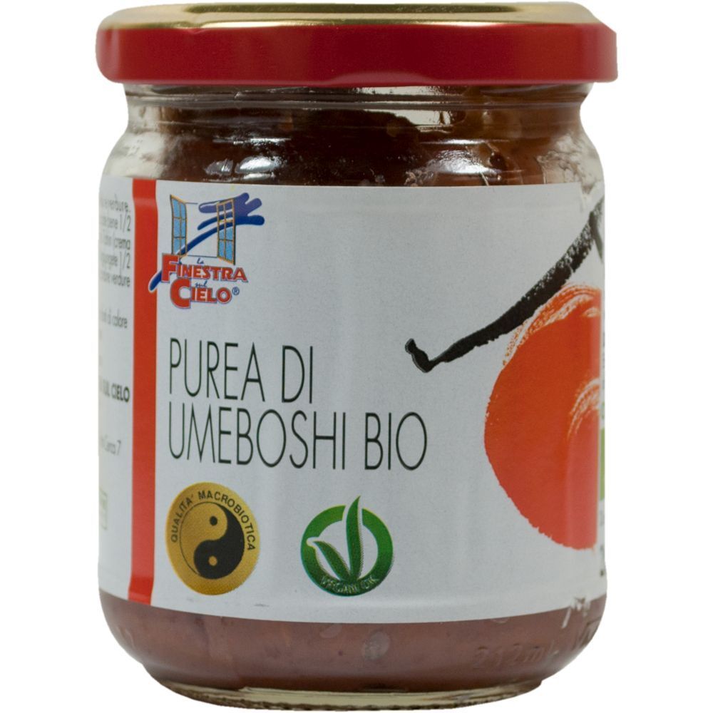 Vasetto con tappo rosso. Etichetta con logo, testo: Purea di Umeboshi Bio. Sigilli vegano e macrobiotico.