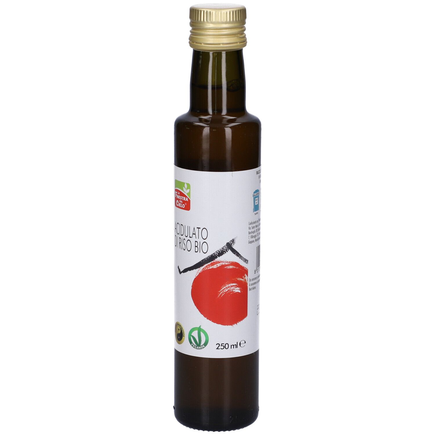 Bottiglia di vetro marrone con tappo dorato. Etichetta con nome del prodotto e cerchio rosso.