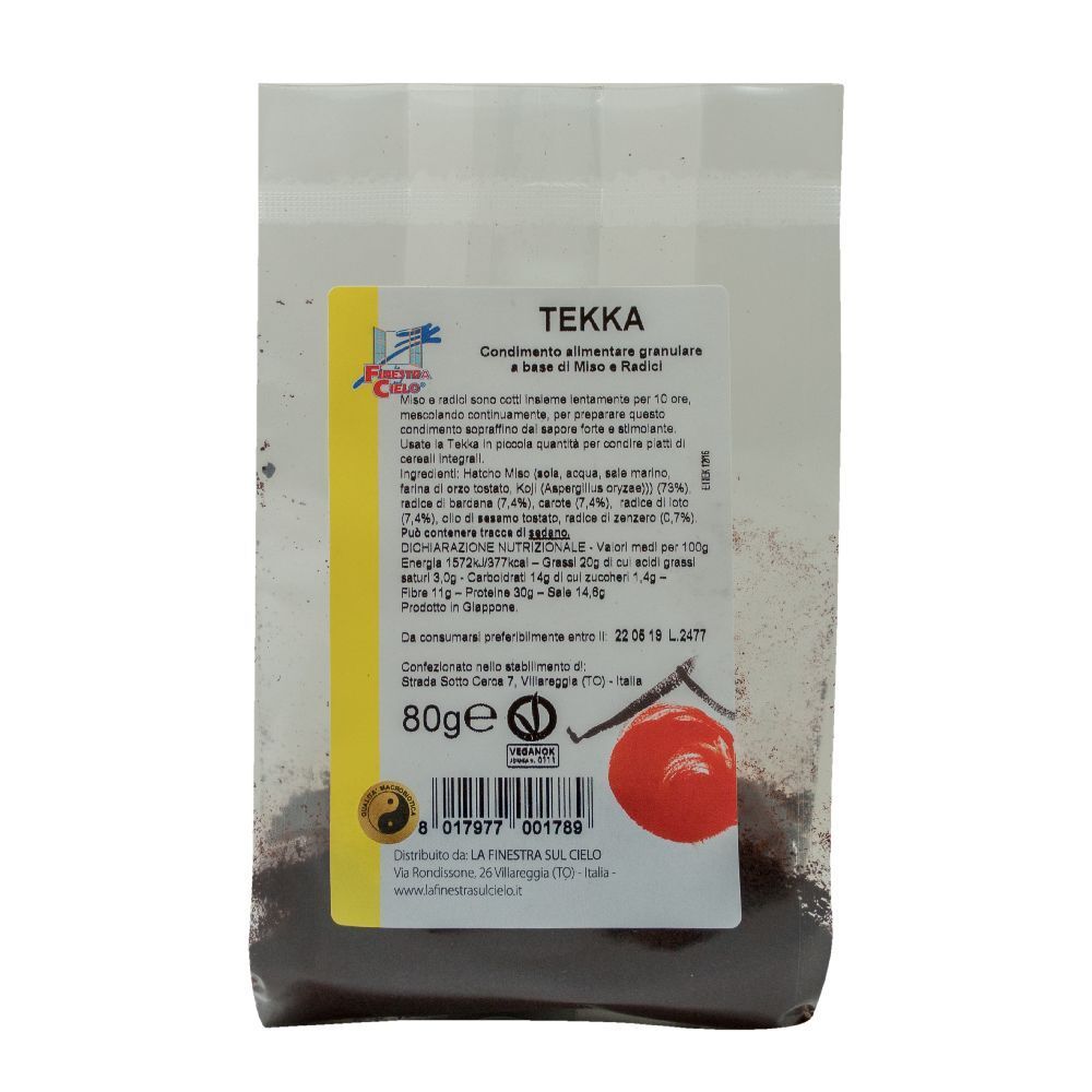 Confezione trasparente con prodotto. Scritta: Tekka Condimento Di Miso E Radici, 80g. Etichetta con ingredienti e logo.