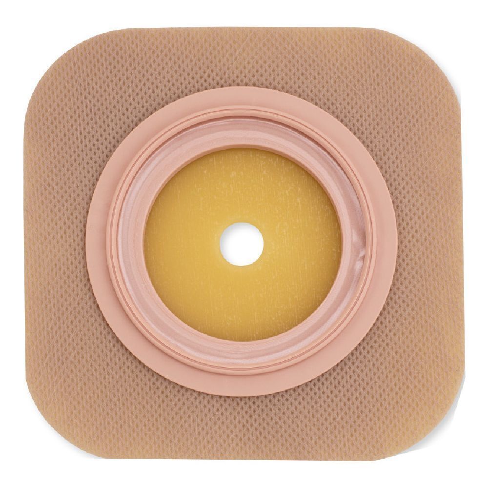 Placca per la protezione della pelle con foro. Beige e giallo. Apertura rotonda al centro. Anello rosa.