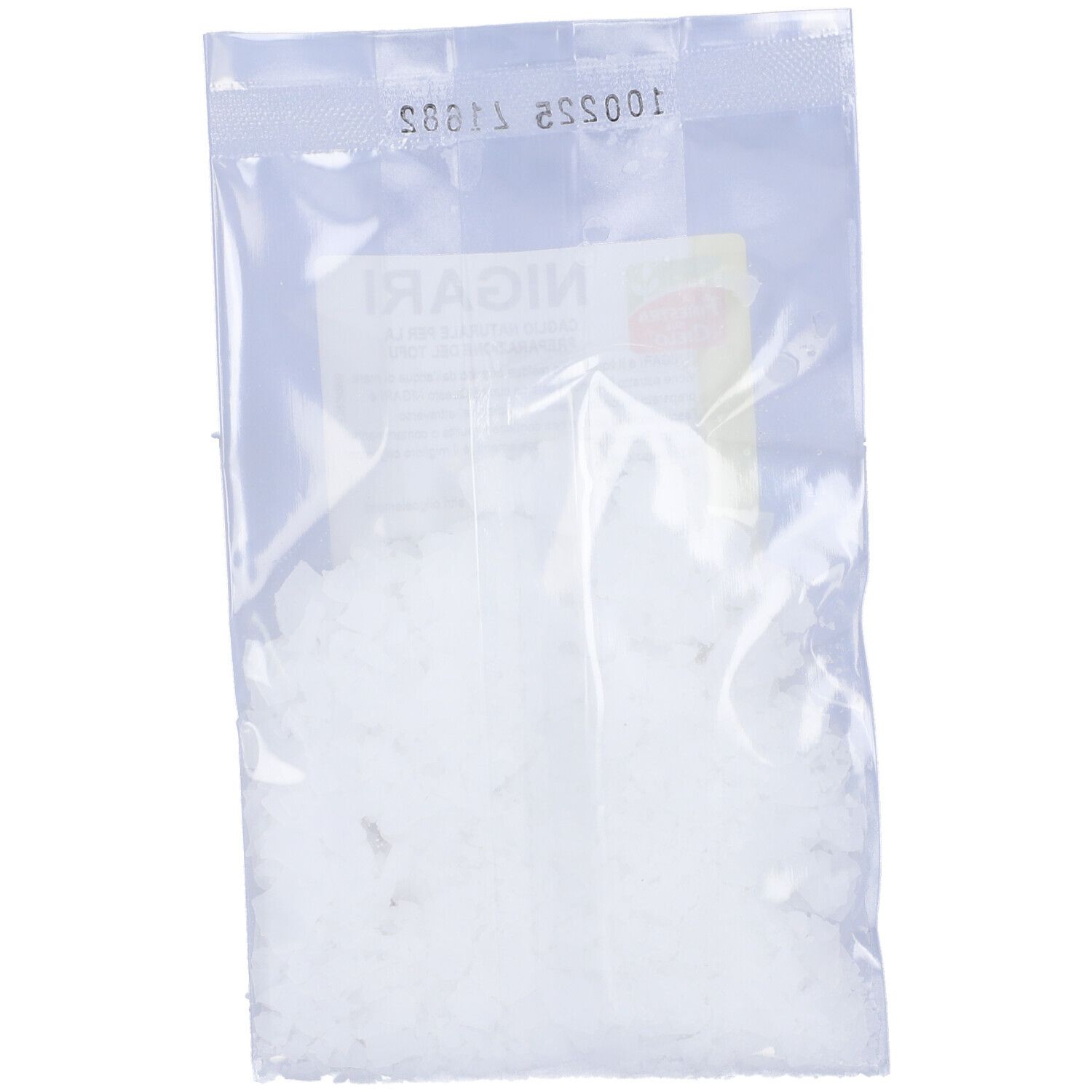 Busta trasparente con contenuto bianco. Scritta "Nigari" illeggibile. Etichetta gialla parzialmente visibile.
