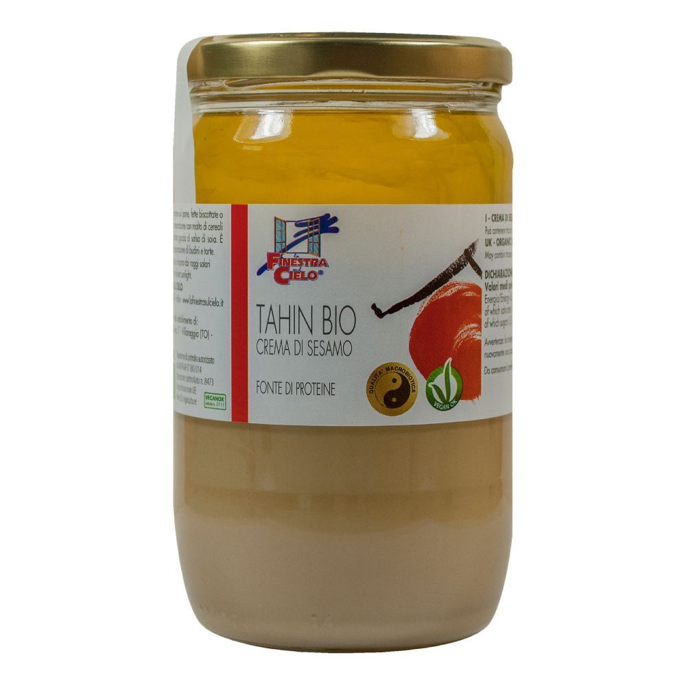 Vasetto di Tahin Bio, crema di sesamo. Etichetta con logo, testo e illustrazione. Coperchio dorato.