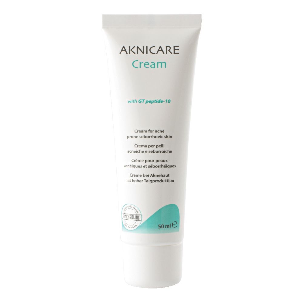 Tubo bianco con scritta AKNICARE Cream. Contiene 50 ml. Testo: Cream for acne prone seborrhoeic skin.