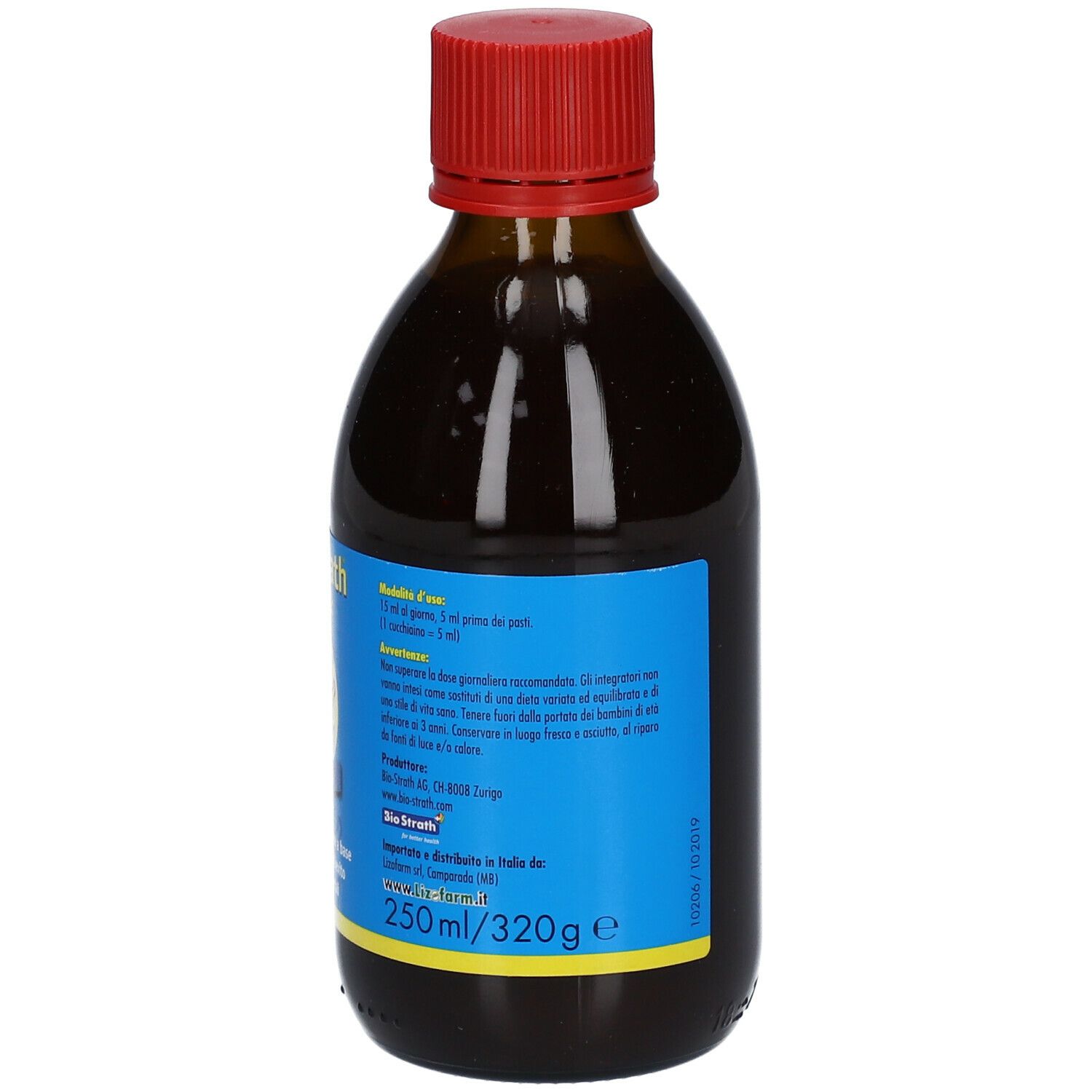 Bottiglia di vetro marrone con tappo rosso. Etichetta con informazioni sul prodotto. Liquido visibile.