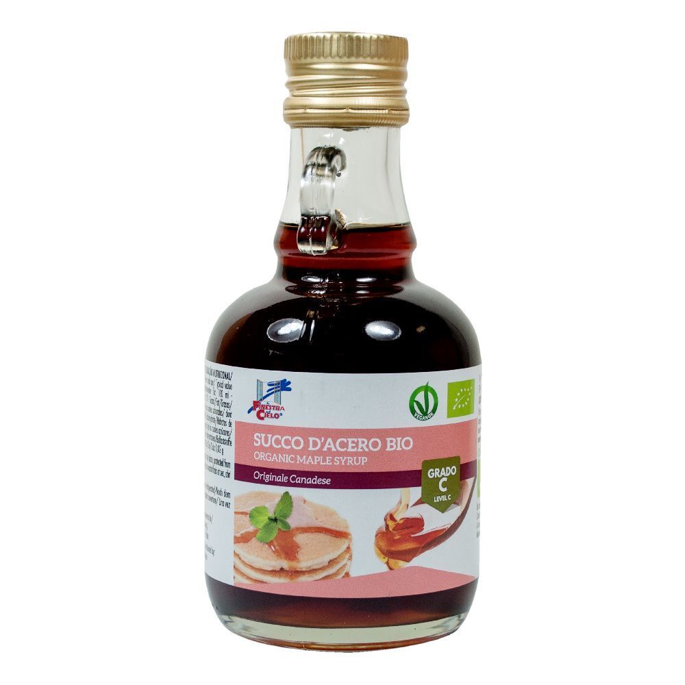 Bottiglia di vetro di sciroppo d'acero. Etichetta con testo: Succo d'Acero Bio, Grado C. Immagine di pancake.