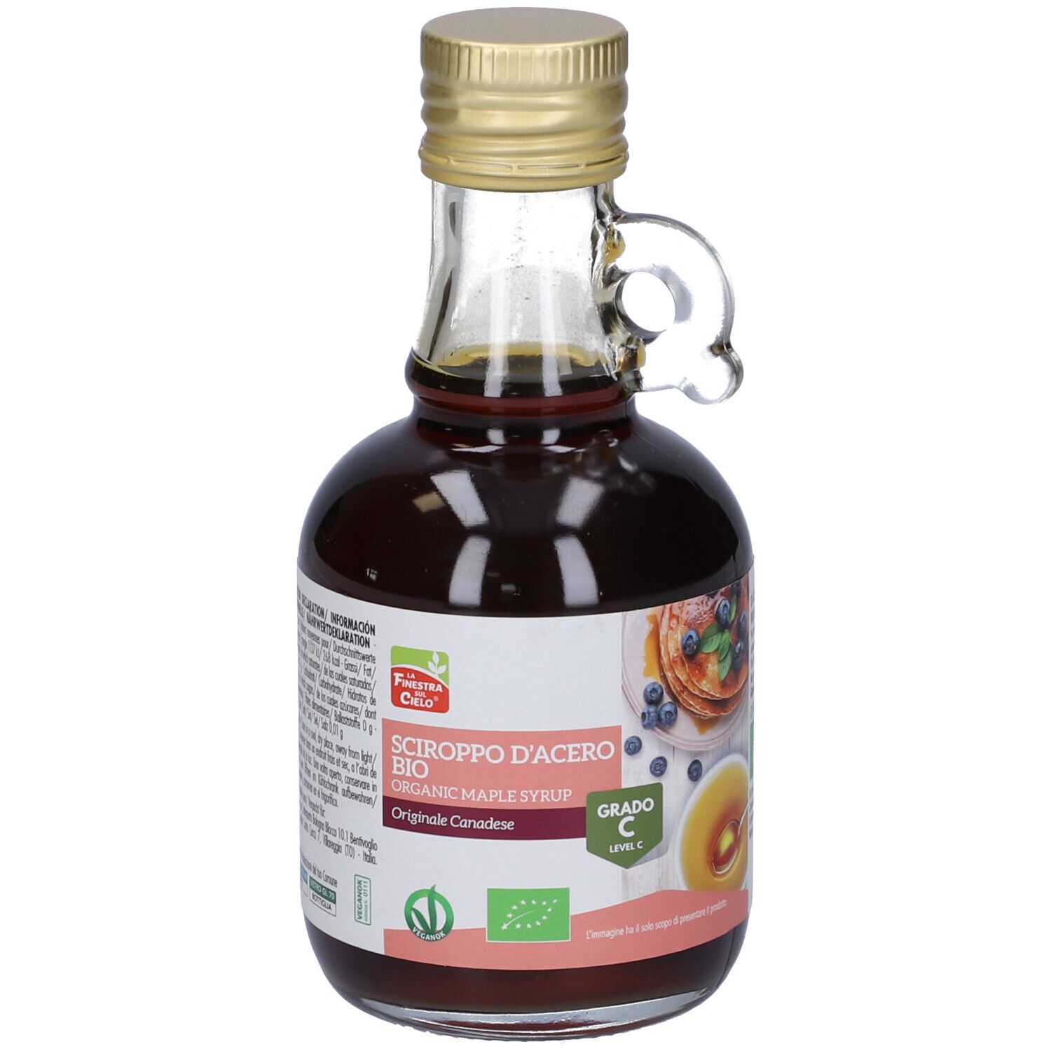 Bottiglia di vetro di sciroppo d'acero. Etichetta con testo: Sciroppo d'Acero Bio, Grado C. Immagine di pancake.