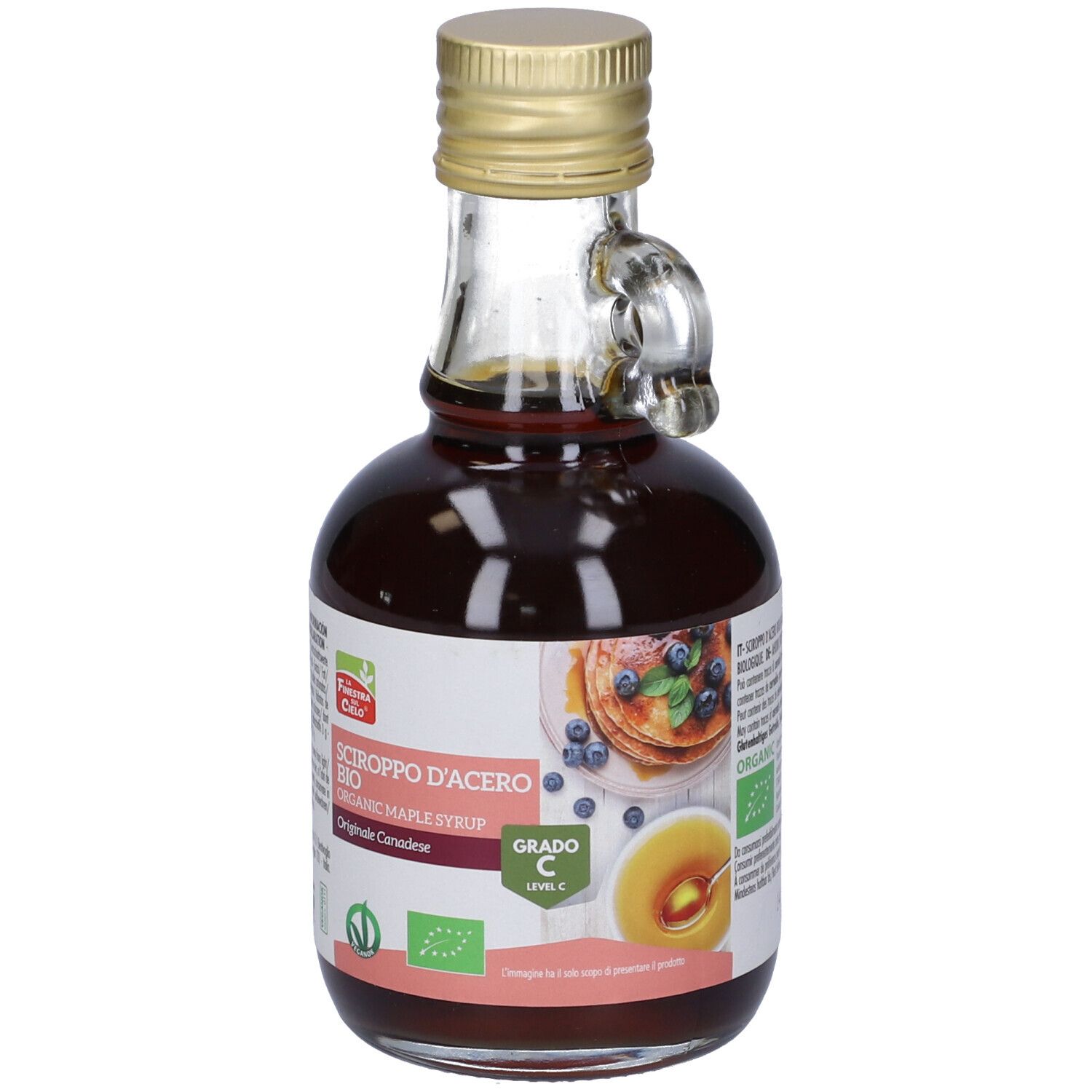 Bottiglia di vetro di sciroppo d'acero. Etichetta con testo: Sciroppo d'Acero Bio, Grado C. Immagine di pancake.