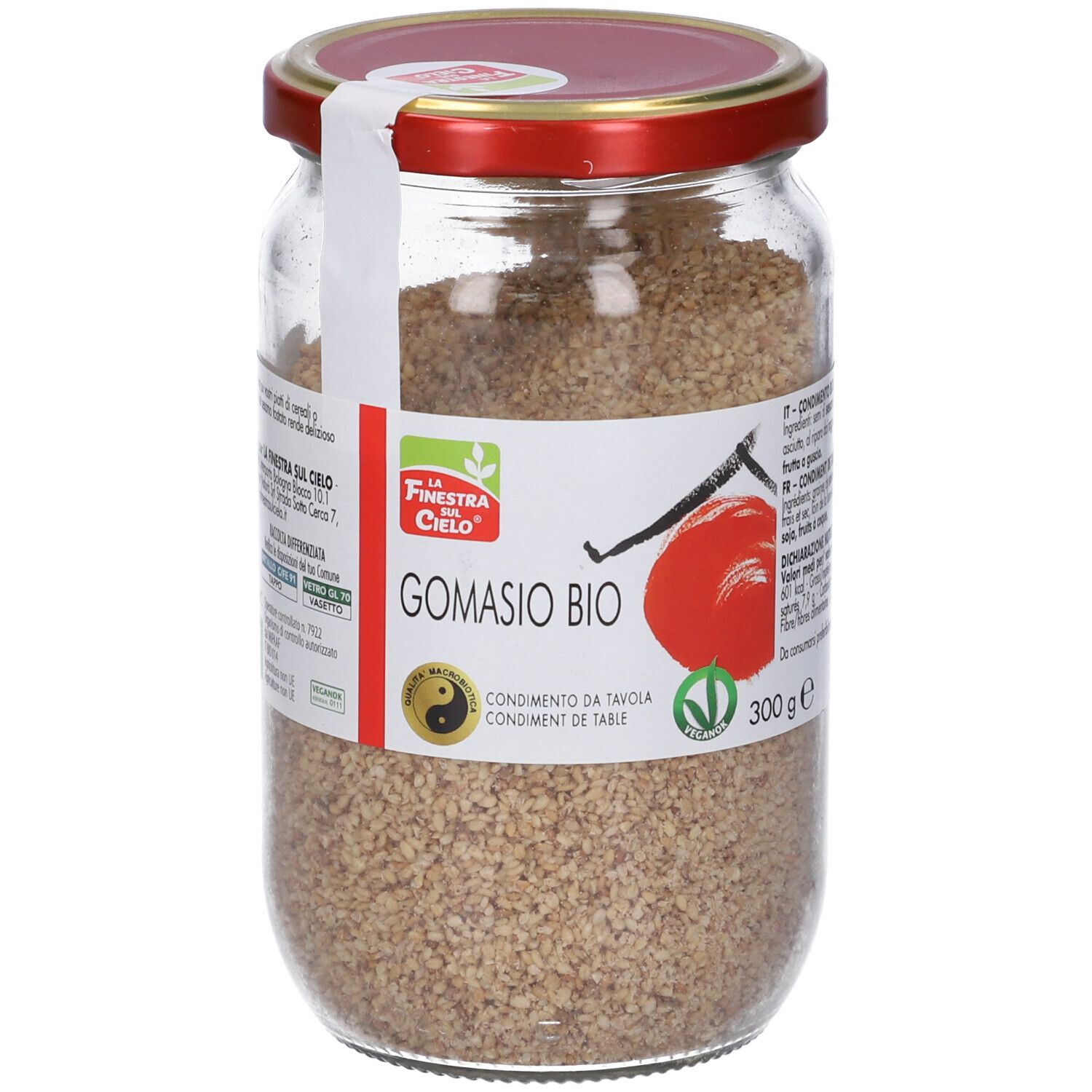 Vasetto di Gomasio Bio. Etichetta con logo, nome prodotto e 300g. Coperchio rosso. Sigillo. Contenuto granulare.