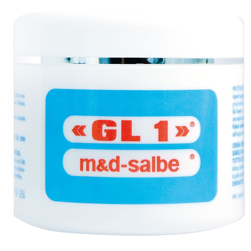 Vasetto bianco con etichetta blu. Scritta: «GL 1» m&d-salbe. Bordo argentato.