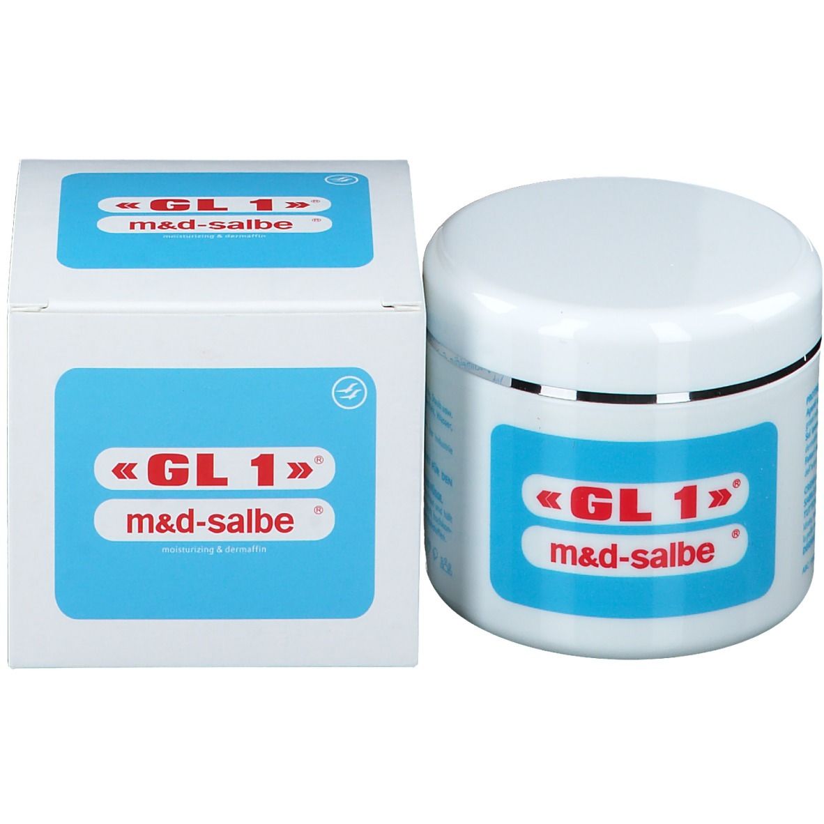 Vasetto e scatola bianchi. Scritta «GL 1» m&d-salbe. Etichetta blu. Bordo argentato.