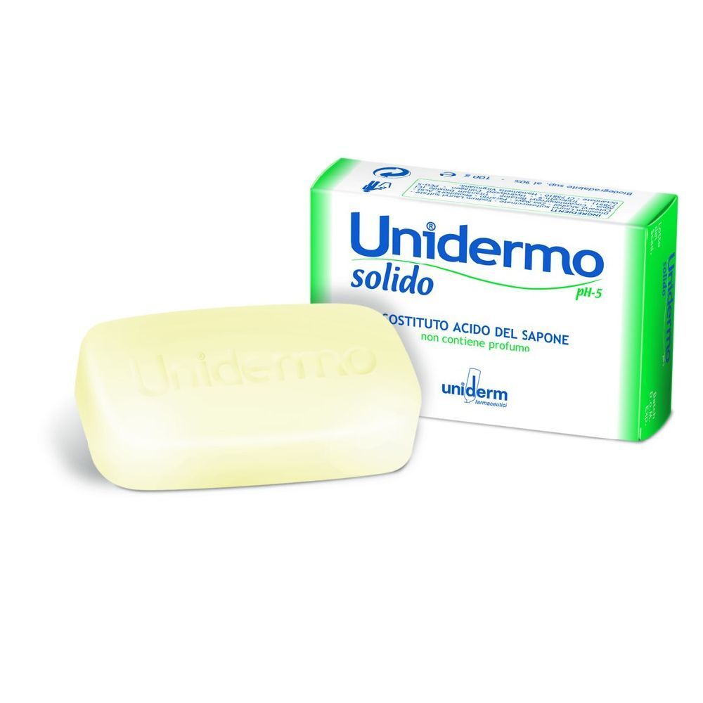 Panetto di sapone giallo chiaro e confezione. Sulla confezione 'Unidermo solido pH-5'.