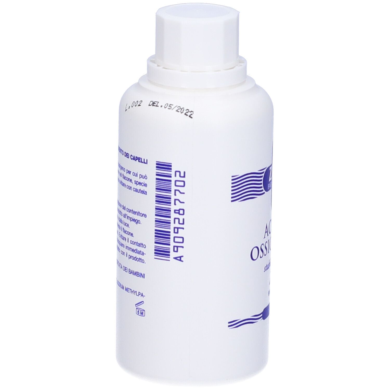 Flacone bianco con etichetta blu e codice a barre. Scritta: Acqua Ossigenata. Retro con testo e codice a barre.