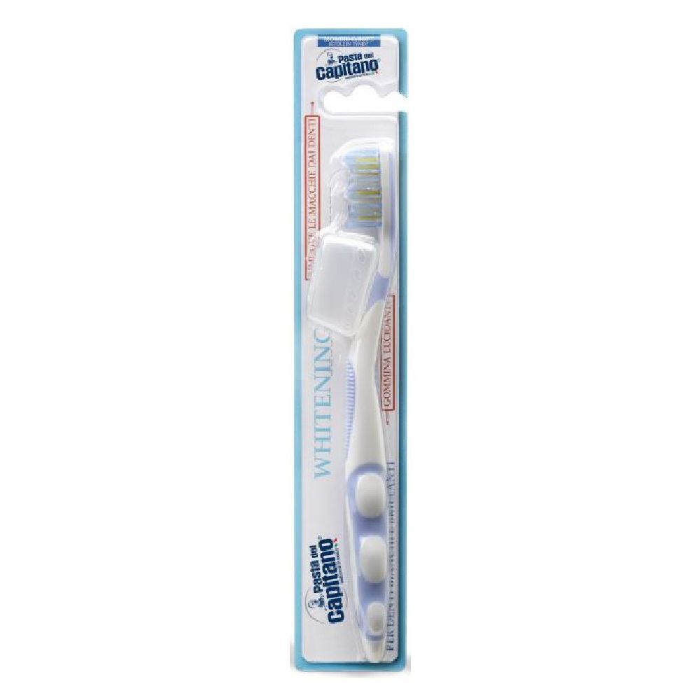 Spazzolino in blister. Manico bianco, dettagli blu, setole gialle. Scritta "Whitening".