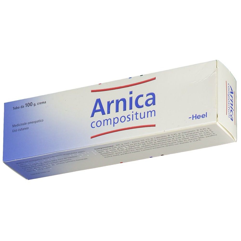 Tubo bianco in una scatola. Scritto: Arnica compositum. Marchio: Heel. Scritta blu e rossa. Testo sulla confezione.