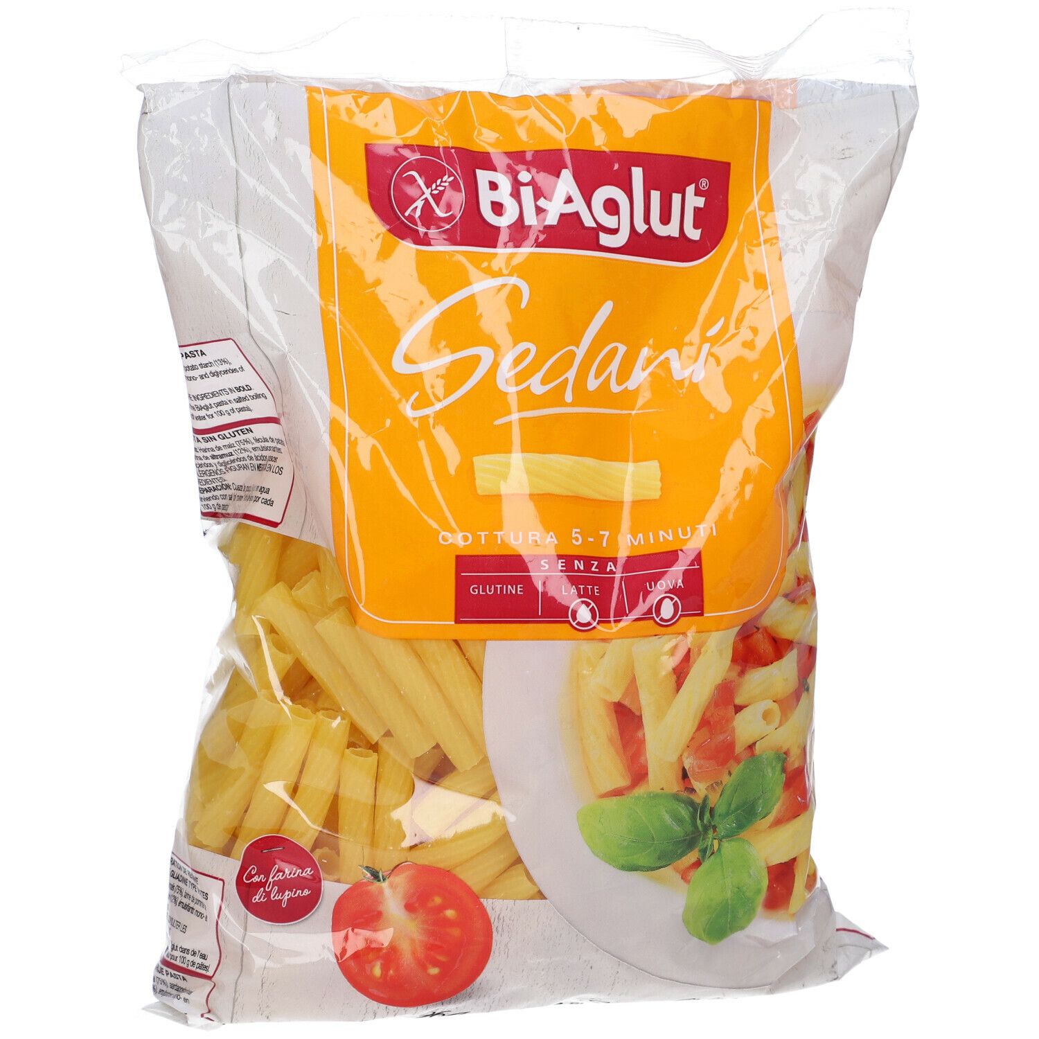 Confezione di pasta Biaglut Sedani. Pasta gialla in busta. Senza glutine, lattosio e soia. Pomodoro e basilico.
