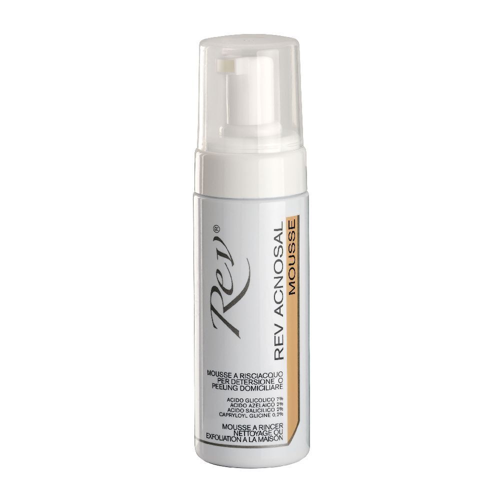 Flacone bianco con pompa. Scritta: Rev Aknosal Mousse. Testo in italiano. Striscia marrone con testo.