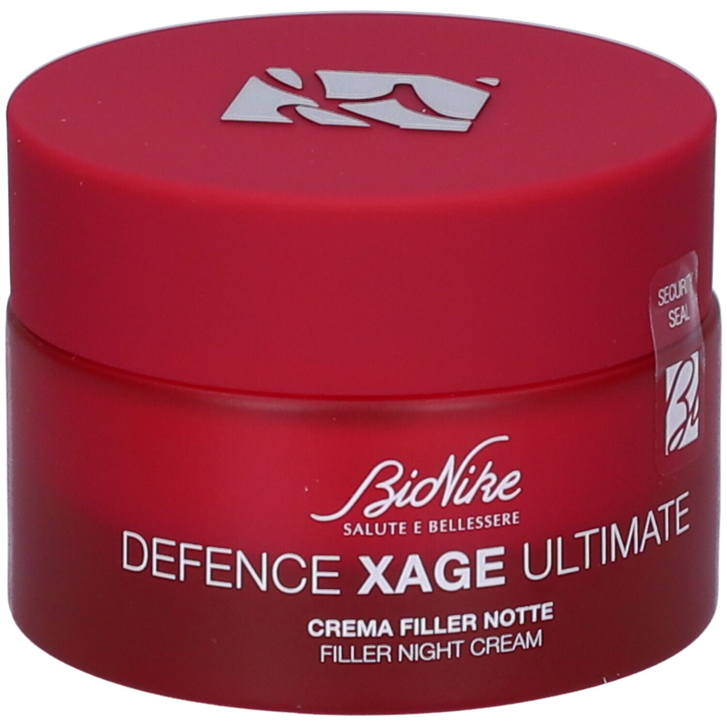 Rote Creme-Dose mit Deckel. Aufschrift: BioNike, Defence Xage Ultimate, Crema Filler Notte, Filler Night Cream. Sicherheitsverschluss.