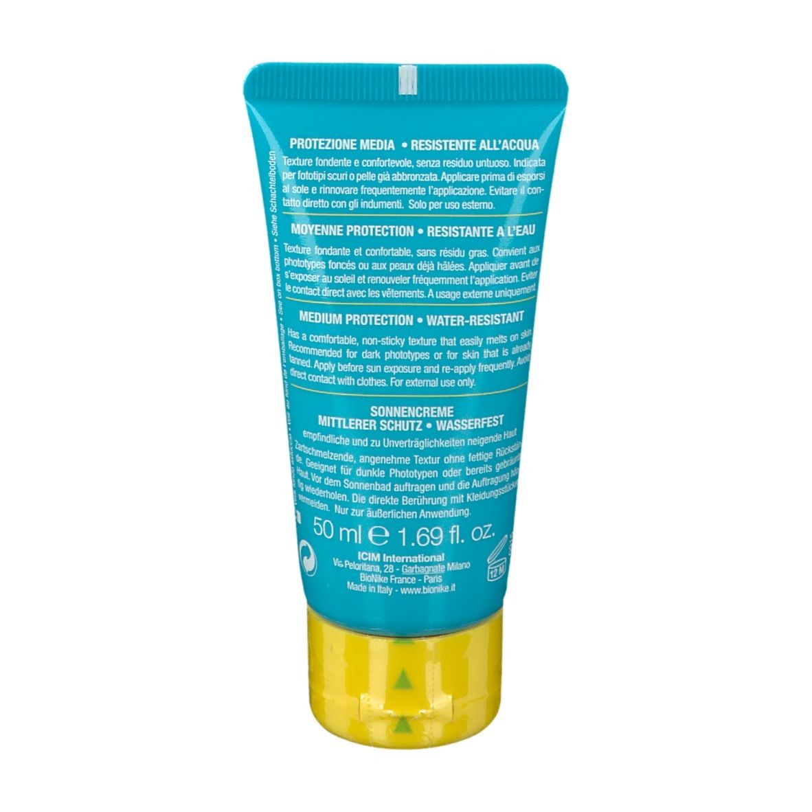 Dos du tube de crème solaire. Texte: Protection moyenne, résistant à l'eau. Ingrédients et instructions. 50 ml. Testé au nickel, sans parfum ni gluten.